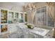 Bright dining room features a chandelier, built-in cabinets, and seating for six people at 5281 W Quail Ave, Glendale, AZ 85308