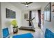 Home gym with a treadmill, yoga mats, and a motivational phonetic alphabet wall art at 5281 W Quail Ave, Glendale, AZ 85308