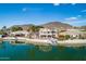 Lovely waterfront home with a private dock, lush landscaping, and beautiful water views at 5281 W Quail Ave, Glendale, AZ 85308