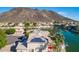 Home with solar panels overlooking a lake and mountain backdrop, complemented by lush landscaping at 5281 W Quail Ave, Glendale, AZ 85308