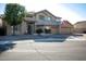Inviting two-story home with a three-car garage and desert landscaping at 5281 W Quail Ave, Glendale, AZ 85308