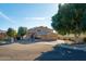 Charming home featuring a manicured lawn, mature trees, and a spacious three-car garage at 5281 W Quail Ave, Glendale, AZ 85308