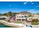 Beautiful waterfront home with lush landscaping, solar panels, and multiple outdoor living spaces at 5281 W Quail Ave, Glendale, AZ 85308