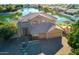 Beautiful lakefront home with a manicured lawn, gazebo and a three-car garage at 5281 W Quail Ave, Glendale, AZ 85308