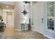 Welcoming foyer features tile flooring, natural light, and an elegant side table at 5281 W Quail Ave, Glendale, AZ 85308