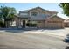 Attractive two-story home featuring a well-manicured lawn and a three car garage at 5281 W Quail Ave, Glendale, AZ 85308