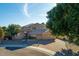 Charming two-story home with a well-manicured front yard and a three-car garage at 5281 W Quail Ave, Glendale, AZ 85308