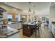 Open-concept kitchen with granite countertops, a large island, and modern stainless steel appliances at 5281 W Quail Ave, Glendale, AZ 85308