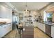 Modern kitchen featuring custom cabinetry, granite countertops, and a chef-grade stainless steel appliances at 5281 W Quail Ave, Glendale, AZ 85308