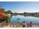 Beautiful lake view with a dock and seating area offers a peaceful retreat right in your backyard at 5281 W Quail Ave, Glendale, AZ 85308