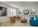 Bright living room boasts built-in shelving, modern ceiling fan, and comfortable seating at 5281 W Quail Ave, Glendale, AZ 85308