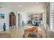 Bright, open living space with tiled floors, views of the dining area, and modern furnishings at 5281 W Quail Ave, Glendale, AZ 85308