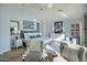Stylish main bedroom with accent chairs, white dresser, and bright, sunny decor at 5281 W Quail Ave, Glendale, AZ 85308
