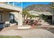 Relaxing outdoor living space with cozy seating and mature landscaping provides shade in this backyard at 5281 W Quail Ave, Glendale, AZ 85308