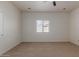 Neutral bedroom with a window and ceiling fan providing a calming and comfortable atmosphere at 5635 S 11Th Dr, Phoenix, AZ 85041