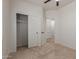 Comfortable bedroom featuring a closet for storage and a door leading to an en-suite bathroom at 5635 S 11Th Dr, Phoenix, AZ 85041