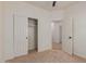 Well-lit bedroom with closet space and a doorway leading to another room at 5635 S 11Th Dr, Phoenix, AZ 85041