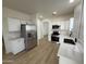 Spacious kitchen featuring stainless steel appliances, white cabinets, and modern countertops at 5635 S 11Th Dr, Phoenix, AZ 85041