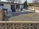 Backyard featuring a gravel area and a covered patio with outdoor seating, perfect for relaxation and entertainment at 5728 E Dodge St, Mesa, AZ 85205