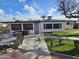 A backyard with a lush lawn, garden area, and outdoor seating, creating a peaceful retreat at 5728 E Dodge St, Mesa, AZ 85205