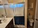 Bathroom showcasing a sink vanity, toilet, and shower with a sliding door, ensuring functionality at 5728 E Dodge St, Mesa, AZ 85205
