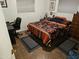 A bedroom featuring a bed, desk, and chair, providing a comfortable and functional space at 5728 E Dodge St, Mesa, AZ 85205