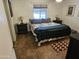 Comfortable bedroom features a large bed, side tables, and stylish flooring at 5728 E Dodge St, Mesa, AZ 85205
