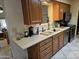 Practical kitchen layout featuring wood cabinetry, white countertops, and essential appliances at 5728 E Dodge St, Mesa, AZ 85205