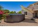 Backyard featuring an above-ground pool with desert landscaping and colorful bougainvillea at 5735 S Cloverdale Ln, Gilbert, AZ 85298