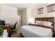 Spacious bedroom with a large bed, a desk, and access to the ensuite bathroom at 5735 S Cloverdale Ln, Gilbert, AZ 85298