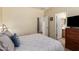 Bright bedroom with carpet flooring and a view of the ensuite bathroom at 5735 S Cloverdale Ln, Gilbert, AZ 85298