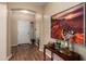 Bright entryway with wood floors, neutral paint, and decorative accents at 5735 S Cloverdale Ln, Gilbert, AZ 85298