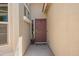 Inviting front entrance featuring a decorative door with sidelights and a potted plant at 5735 S Cloverdale Ln, Gilbert, AZ 85298