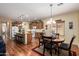 Large kitchen with an island, stainless appliances, and adjacent dining area for casual meals at 5735 S Cloverdale Ln, Gilbert, AZ 85298
