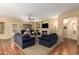 Comfortable living room with a fireplace, plush sofas, and open layout at 5735 S Cloverdale Ln, Gilbert, AZ 85298