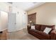 Comfortable living room showcasing neutral walls and a cozy couch with throw pillows at 5735 S Cloverdale Ln, Gilbert, AZ 85298