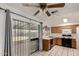Functional kitchen with tile floors, classic cabinetry, and a sliding door to the backyard at 635 W Flower Ave, Mesa, AZ 85210