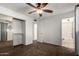 Standard bedroom with carpet, fan and closet for optimal storage at 635 W Flower Ave, Mesa, AZ 85210