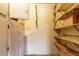 View of storage area, with built in cabinetry and shelving at 635 W Flower Ave, Mesa, AZ 85210