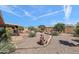 Low maintenance backyard with decorative plants and a covered patio at 6448 E Des Moines St, Mesa, AZ 85205