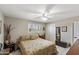 Bright bedroom with a ceiling fan, and neutral color palette at 6448 E Des Moines St, Mesa, AZ 85205