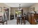 Dining area with tile flooring, backyard access, and an open layout into the kitchen at 6448 E Des Moines St, Mesa, AZ 85205