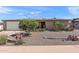 Charming single-story home with desert landscaping, an attached garage, and a tidy facade at 6448 E Des Moines St, Mesa, AZ 85205