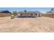Spacious backyard featuring a covered patio and ample room for outdoor activities at 6944 E Gary Cir, Mesa, AZ 85207