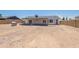 View of the new construction backyard featuring a covered patio and block wall fence at 6944 E Gary Cir, Mesa, AZ 85207