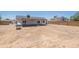 Backyard with a covered patio with ample space for outdoor dining and entertaining at 6944 E Gary Cir, Mesa, AZ 85207
