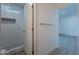 Bathroom with walk-in shower features a tiled shower with a built-in niche for toiletries at 6944 E Gary Cir, Mesa, AZ 85207