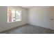 Bright bedroom showcasing a window with a view of the neighborhood at 6944 E Gary Cir, Mesa, AZ 85207