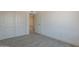 Empty bedroom with closet and light gray flooring at 6944 E Gary Cir, Mesa, AZ 85207