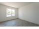 Empty bedroom with natural light streaming in through the window at 6944 E Gary Cir, Mesa, AZ 85207